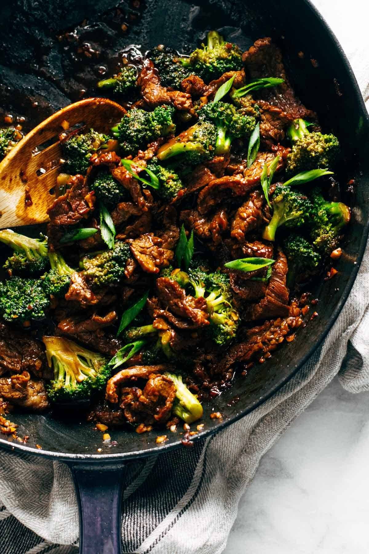 Sesame beef and broccoli in a pan.