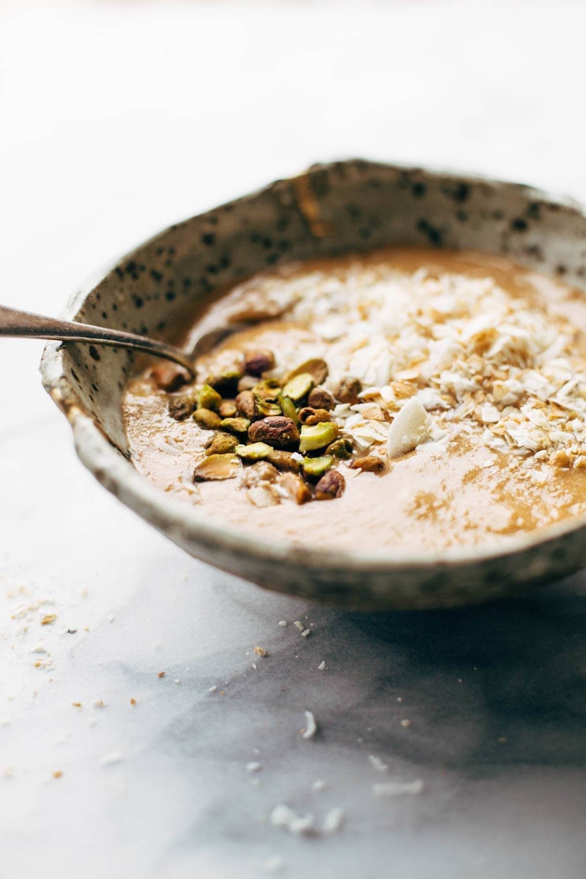 Carrot Cake Smoothie Bowl - an easy, nutrition-packed dessert or snack recipe with a secret super-healthy ingredient! Guilt-free snack! | pinchofyum.com
