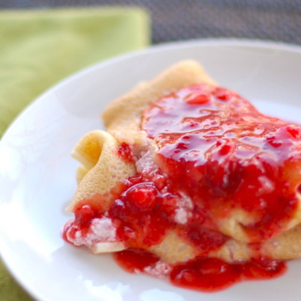 Strawberry blintzes stuffed with creamy ricotta cheese and fresh sweet strawberries.