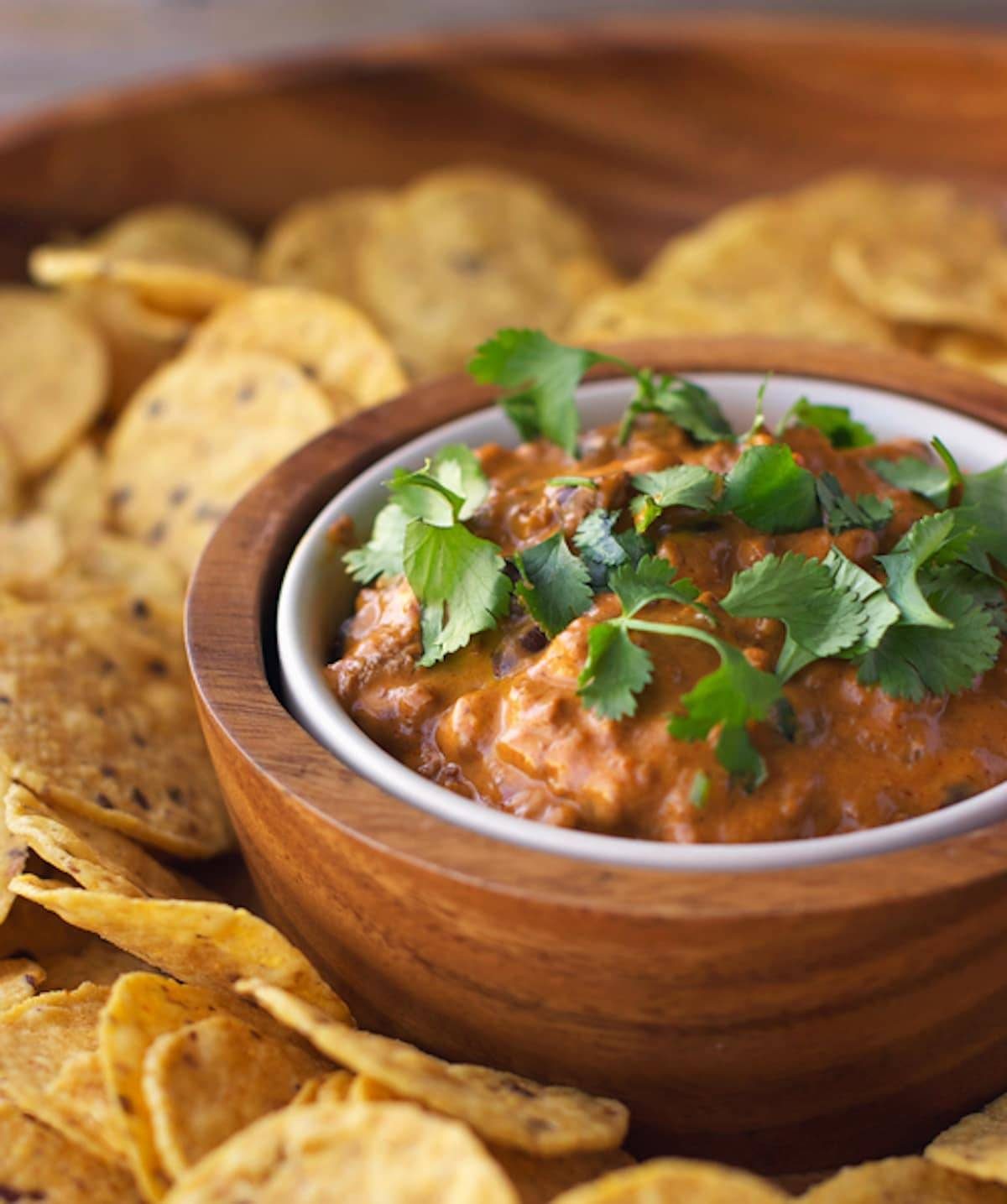 Chili cheese black bean dip served with tortilla chips.