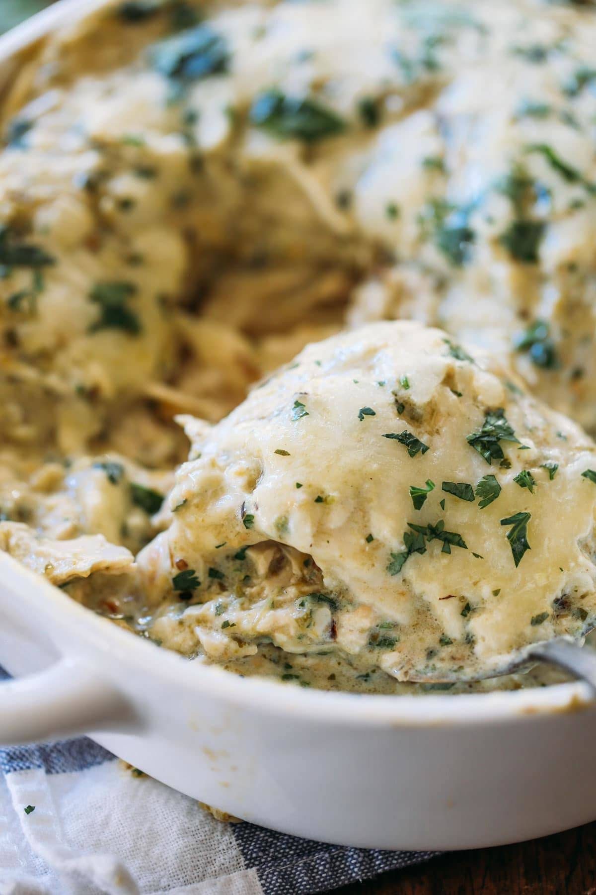 Roasted Tomatillo Chicken Enchilada Casserole in a dish.