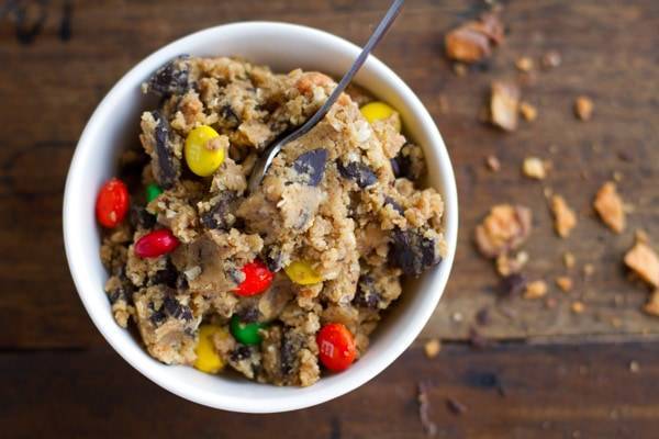 Butterfinger monster cookie dough in a white bowl.