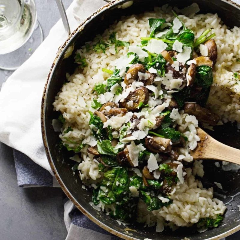 Garlic Butter Mushroom Risotto - super simple! white wine, garlic, mushrooms, butter, spinach, and creamy risotto. 350 calories. | pinchofyum.com #vegetarian #recipe #mushroom #risotto