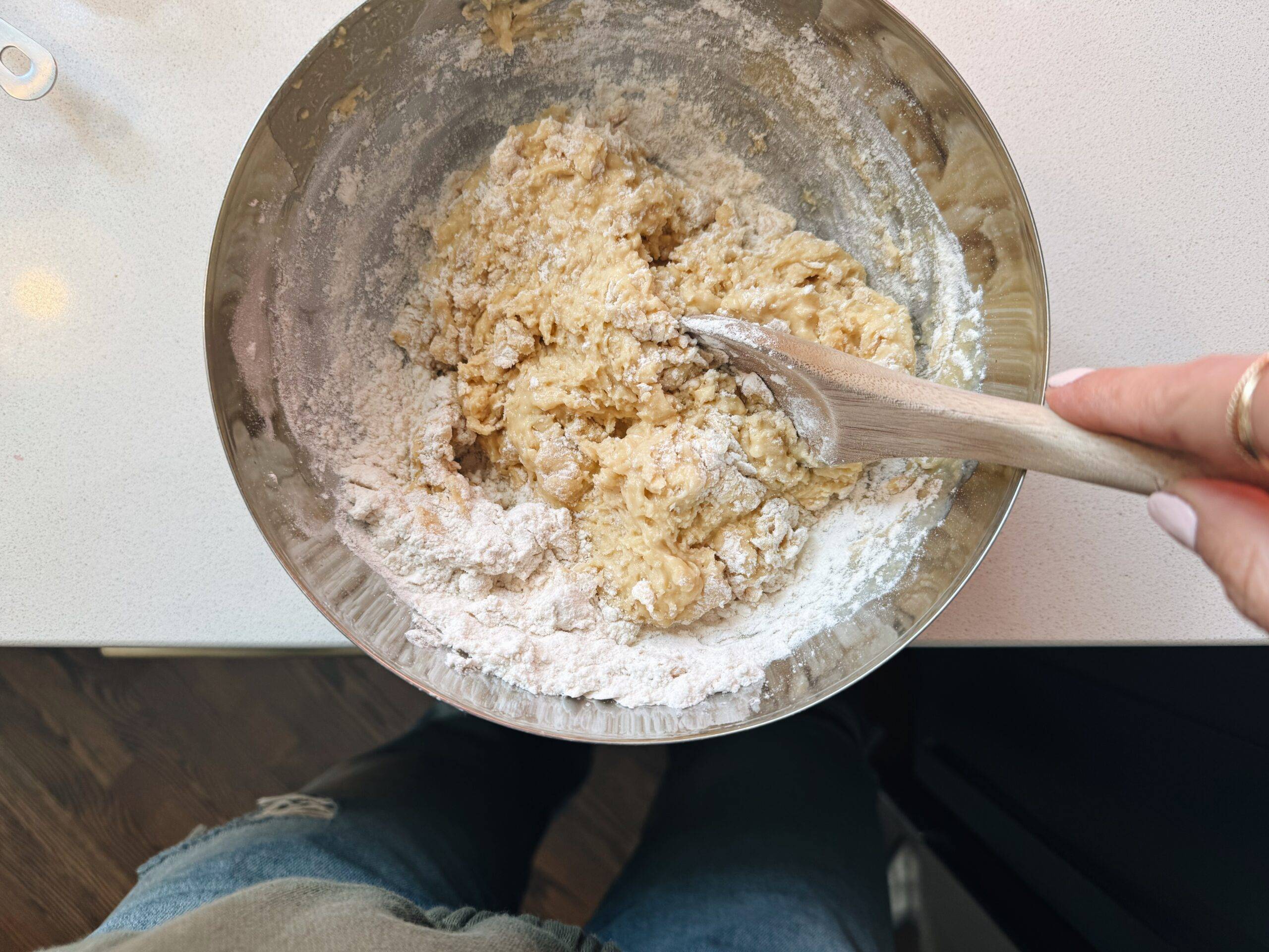 Mixing muffin batter in a bowl.
