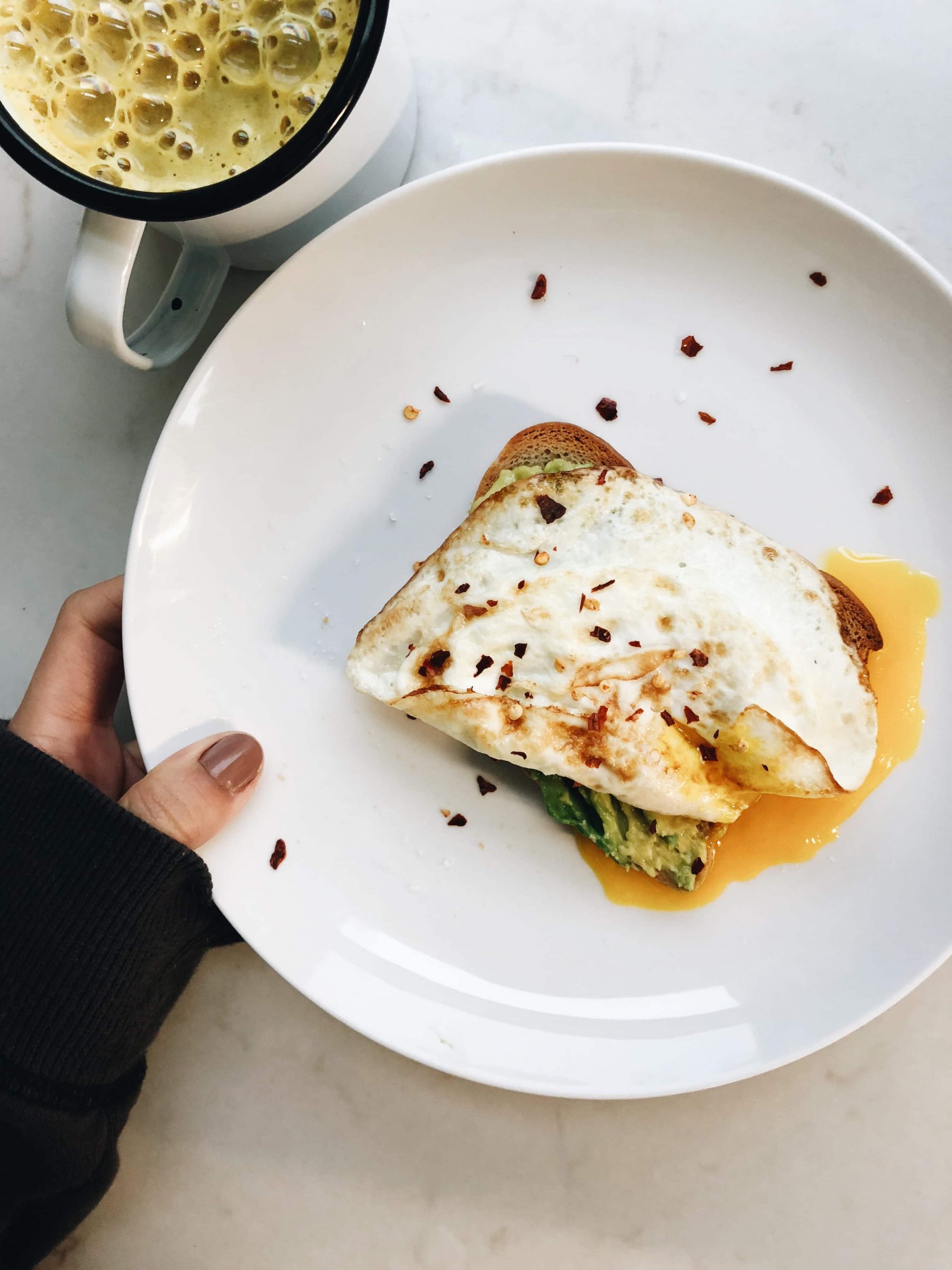 Avocado toast with a runny egg.