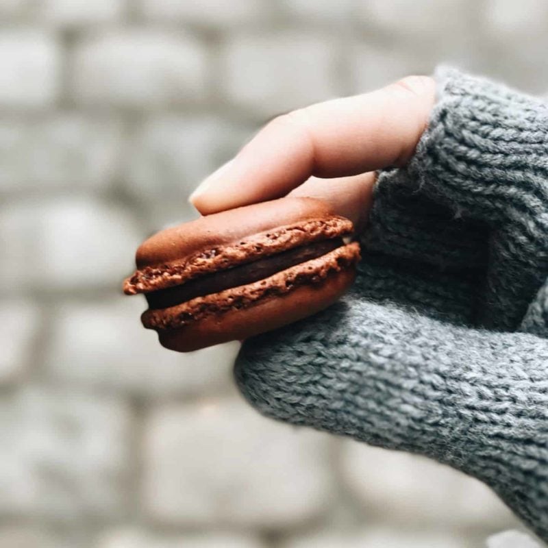 Lindsay holding a macaron.