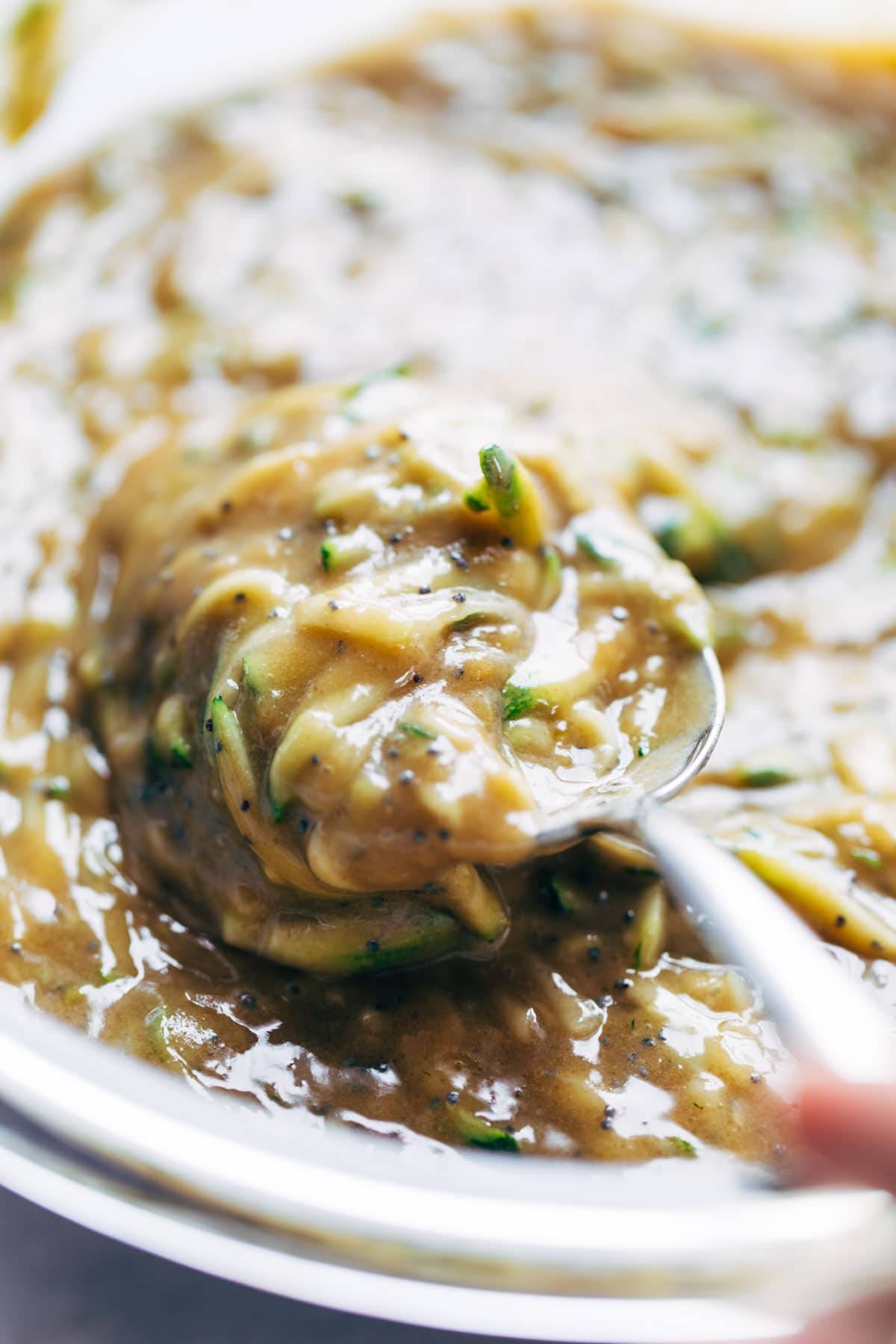 Batter for lemon poppyseed zucchini muffins.