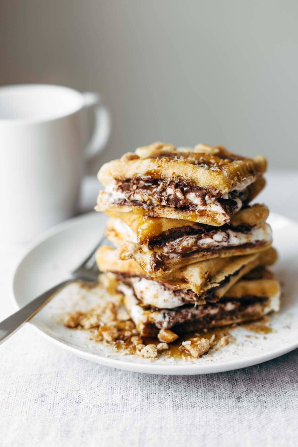 Smores Waffles with Nutella and Toasted Coconut on a plate with a fork