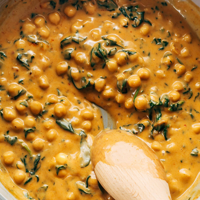 Curry chickpeas in a pan.