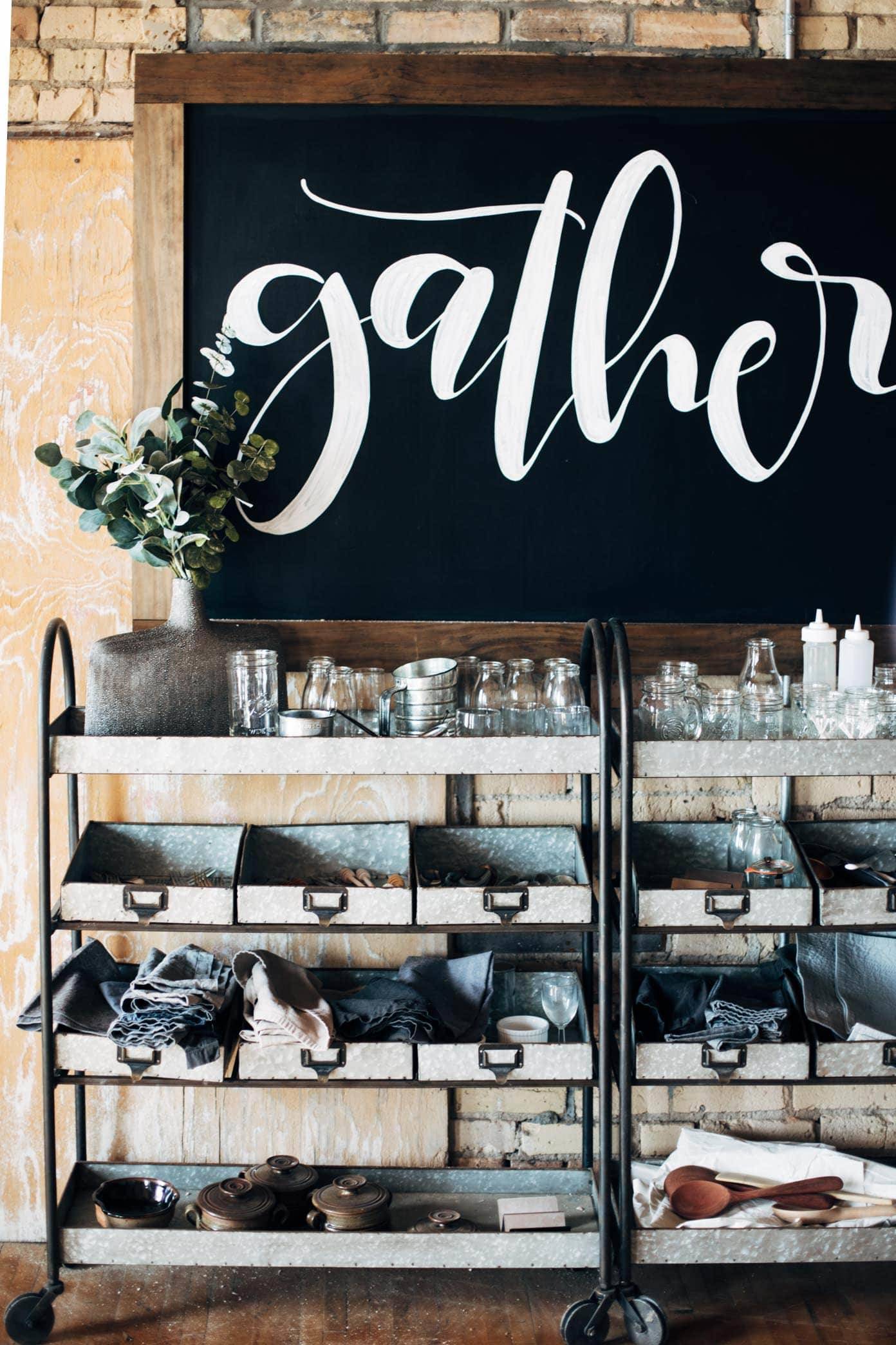 Metal carts filled with cooking and baking supplies and containers.